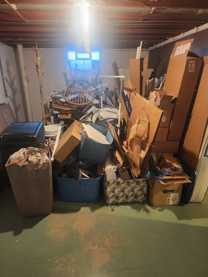 Roll-off dumpster container at job site for 2 Yard Dumpster Rental in Corinth